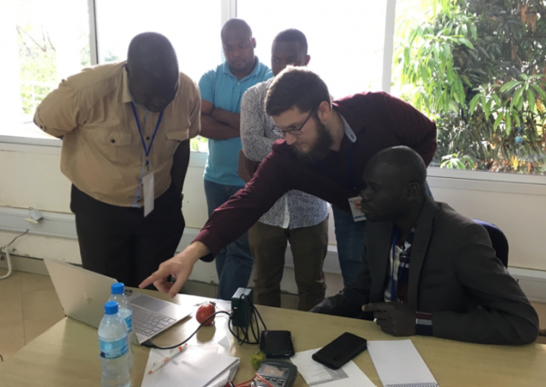 MSE grad student and SciBridge president Mike Spencer (2nd from right) helping workshop participants at 2019 African MRS meeting.