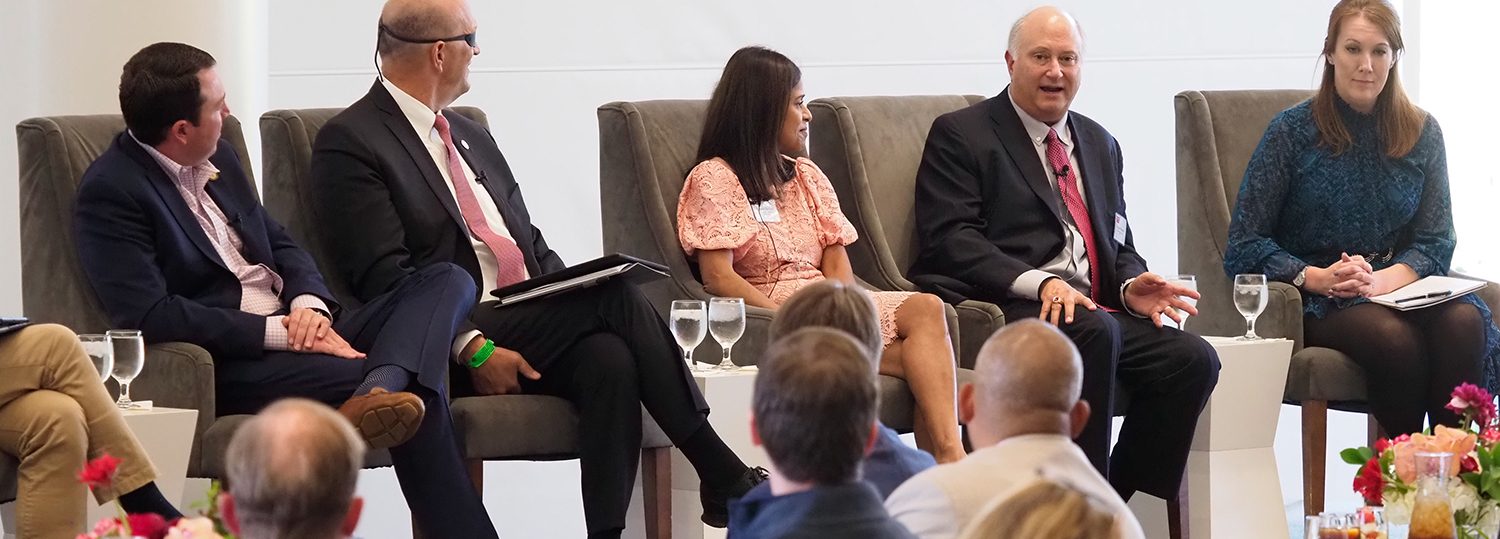 John Palmour, second from right, speaks during a panel discussion at the James B. Hunt Jr. Library on NC State's Centennial Campus in October 2022.