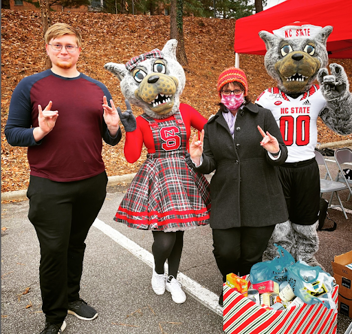 Jennings and Victor at 2021 Staff Senate Food Drive Dropoff with Mr and Mrs Wuf